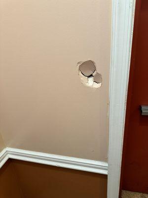 Hole in hallway wall