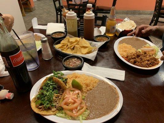 Taco plate with barbacoa and carnitas tacos, rice and beans