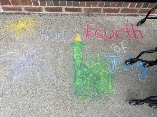 Patriotic chalk drawings in front of Michael's