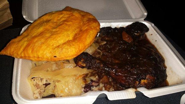 Jerk chicken, beef patty, cabbage, rice and beans