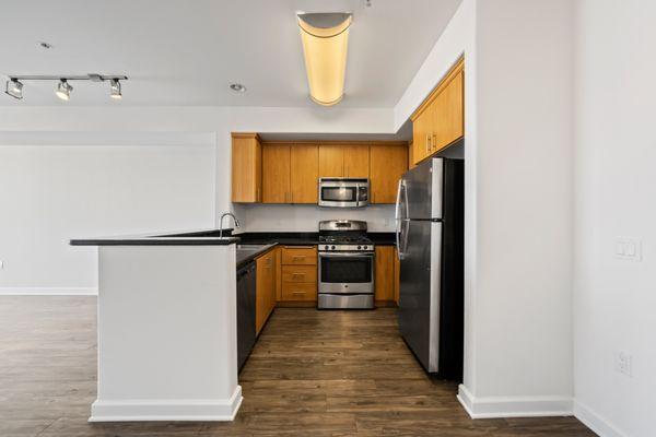 Large Kitchen with Cabinets that go to the Ceiling