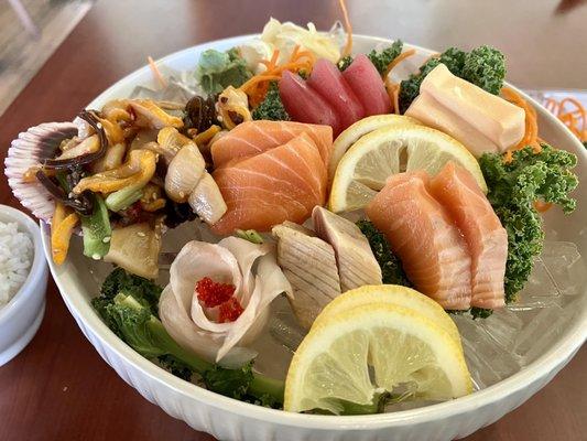 Dinner Sashimi combo. Calamari salad, 5 thin snapper w/roe, 4 salmon, 3 tuna, two white tuna, & 2 albacore tuna.  W/rice & soup.