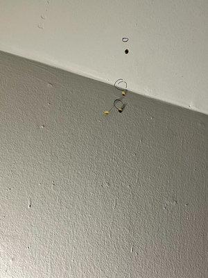 Marked the holes in the wall and ceiling with tacks and sharpie markers