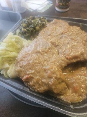 Smothered pork chop cabbage and greens.