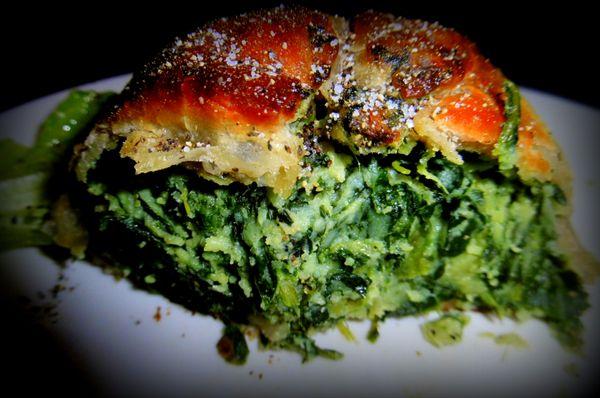 A peek inside the generously filled spinach knish