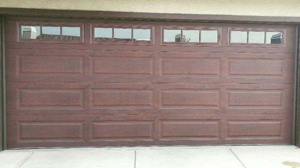 Wood like steel door with Madison window design