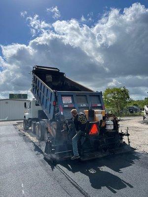 Owner Red Williams paving a new parking lot