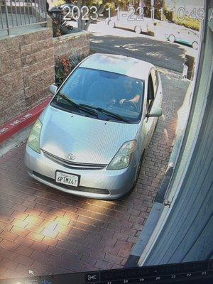 Here's the car and the driver who stole my package from the security cameras .