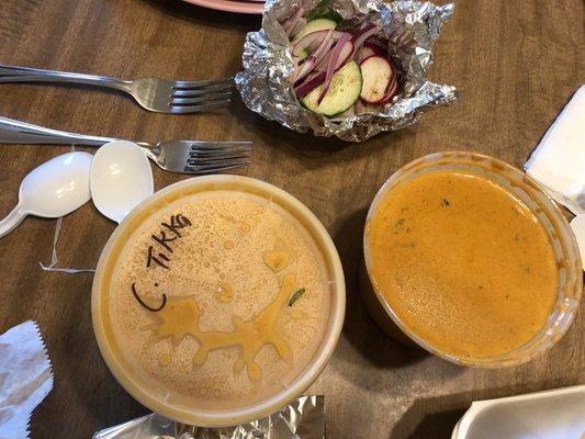 Chicken tikka masala and Shahi Paneer (curry tomato sauce and cheese).  Side of cucumbers, radish, and red onions.