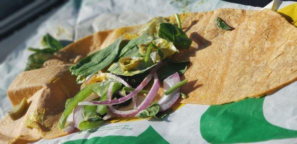 What a horrible wrap God forbid they put any veggies on the veggi6wrsp . Brooking subway sucks ass