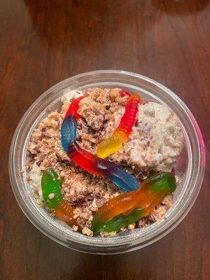 Cookie dough with snickers on top and gummy worms