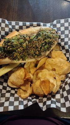 Italian roast pork sandwich topped with garlicky broccoli rabe served with house-made potato chips and a pickle spear