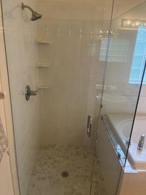 Money saving plan: remodel just the shower area with new tile and custom glass. The tub area is usually fine.