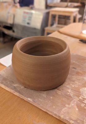 Pot made in muddy time class - before firing and glazing