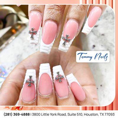 Bold and beautiful!  This eye-catching nail design combines soft pink with striking cross details for a unique look