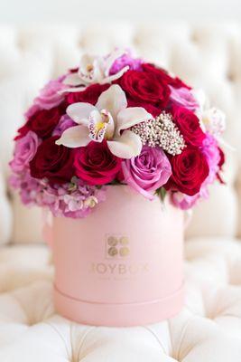 Pink Paradise arrangement with orchids.