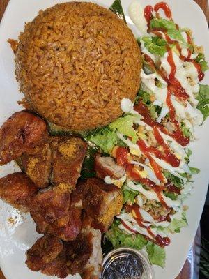 Jollof with salad, chofie and fried plantains