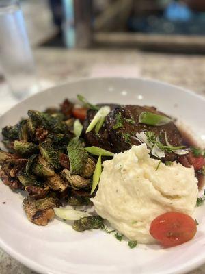 Bacon wrapped meatloaf with garlic mashed potatoes and Brussel sprouts