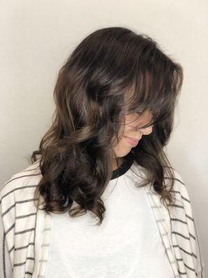 Fun and flirty side swept bangs, long layers, grey coverage, & natural balayage!