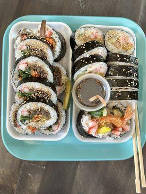 Seafood kimbap, bulgogi kimbap. Freshly made every day, $7.99 to grab and go. (This is two orders in the picture).