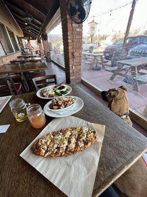 Patio area that is dog friendly! "The pearl" flatbread, the mojo bowl, and chicken fried chicken were all delicious.