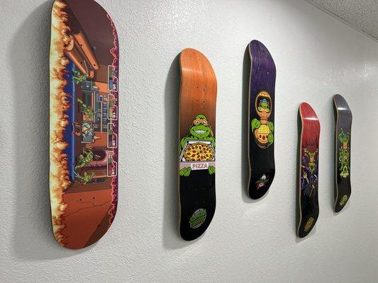 Wall display of TMNT skateboards