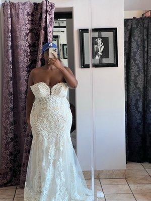 Wedding dress before altered. Too big in the breast area.