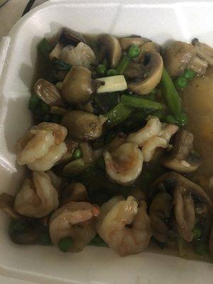 Shrimp with sautéed vegetables. It has a grey color.