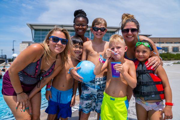 Kids enjoying a snow cone at the outdoor pool