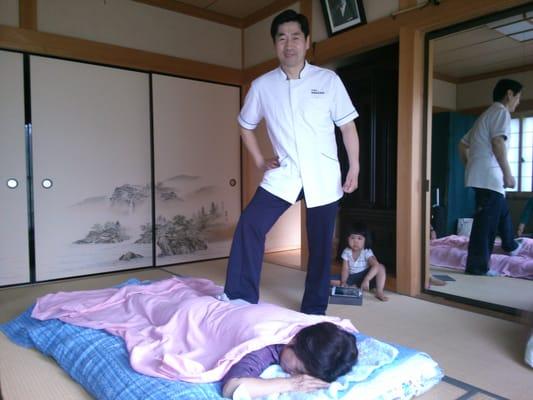 Japanese style Sokssage performed on Futon on the Tatami floor.