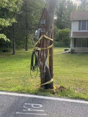 Broken service pole, since 2023, told would be fixed February 2024.  It's June 2024, major storm still held together with twigs.