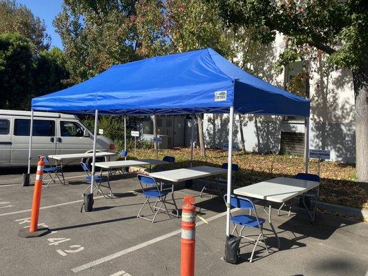 10x20 pop up tent with 4 tables and 8 chairs