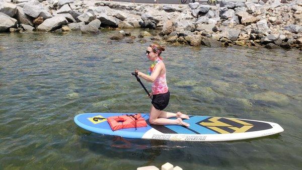 Paddleboarder going out at Pride Paddleout..