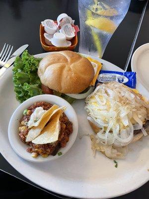 Burger with cheese and grilled onions and a side of Sonora casserole