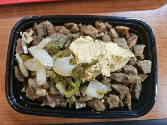 Gyro/Lamb meat over rice with hummus, peppers & onions.