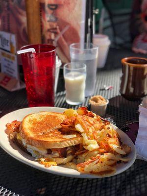 Bacon, egg and cheese on rye with American fries