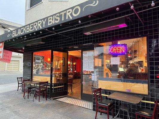 Patio seating and restaurant entrance.