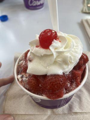 Classic sundae with vanilla ice cream, strawberries and, hot fudge.