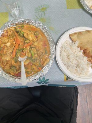 Chicken curry platter which came with rice, naan, and rice pudding.