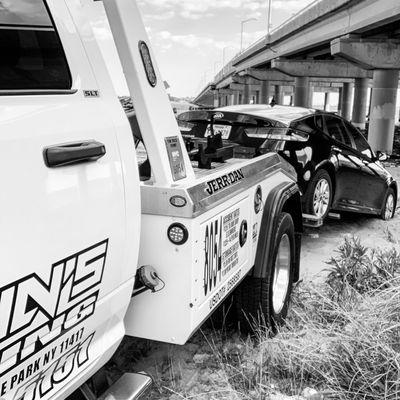 Providing winch and towing services for a customer who got stuck in the sand under crossbay bridge in HOWARD beach queens