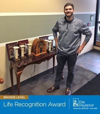 Lake Shore Insurance Agency, Inc., located in Cleveland, Ohio, accepts the Bronze Life Recognition Award from Erie Insurance. (440) 446-1600