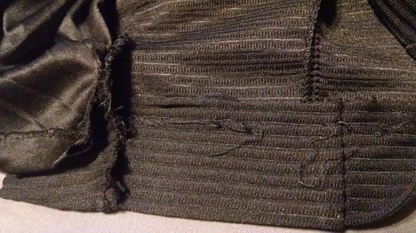 Another section of the unraveled hemline Altug would not bother looking at or fixing.