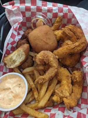 Fried Shrimp, hush puppies, fries, yeast roll and tartar sauce