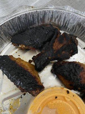 Burnt chicken on the outside and raw in the inside