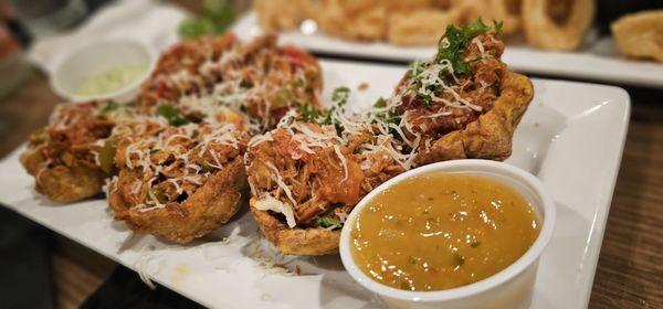 Tostones rellenos... tasty ropa vieja inside fried plantain cups