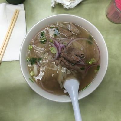 My half ass bowl of pho. With nearly HALF A MEAT BALL cut in half. Horrible.