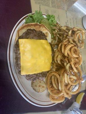 Cheese burger and the greatest hand cut curly fries .