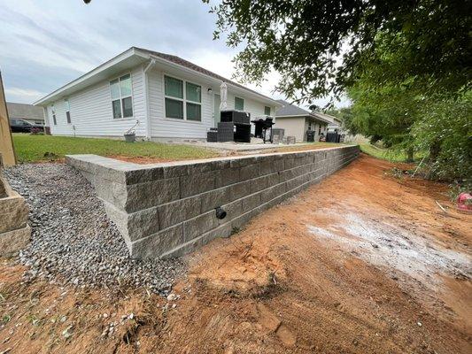 Another proper and certified retaining wall installed in Milton for a slope fix and usable backyard space