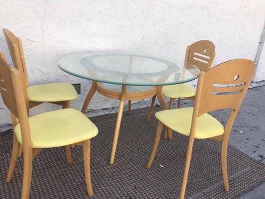 Glass top Dining table plus four chairs .