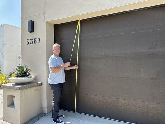 The owner, Mick measuring garage doors!